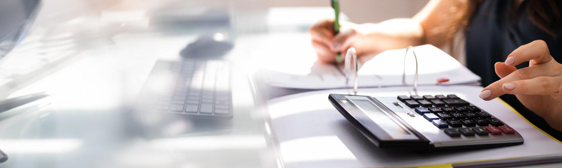 Chartered Accountant Hand Calculating Tax And Salary