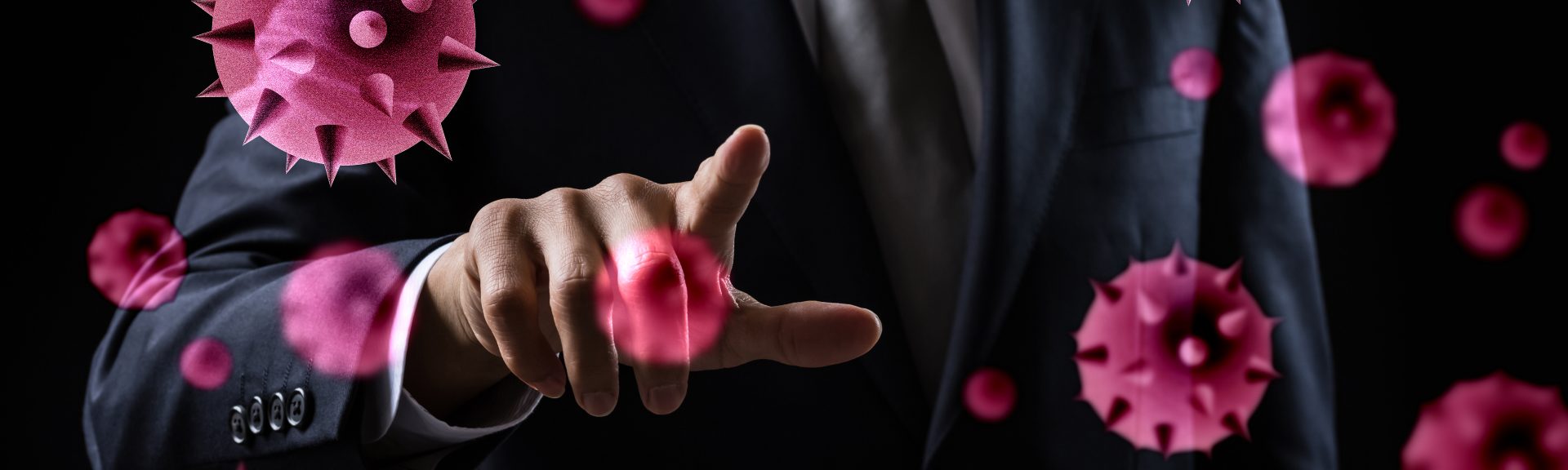 A man in a suit points at floating virus particles, 3D