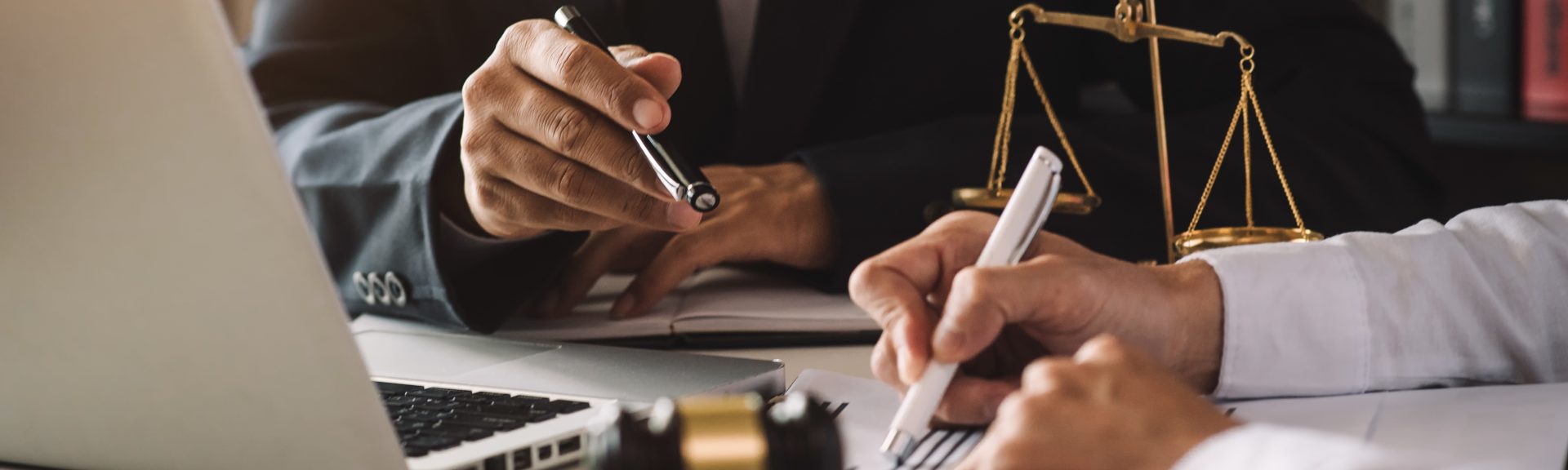 business people and lawyers discussing contract papers sitting at the table. Concepts of law, advice, legal services. in morning light