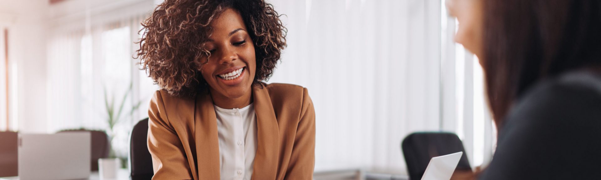 Female client consulting with a agent in the office