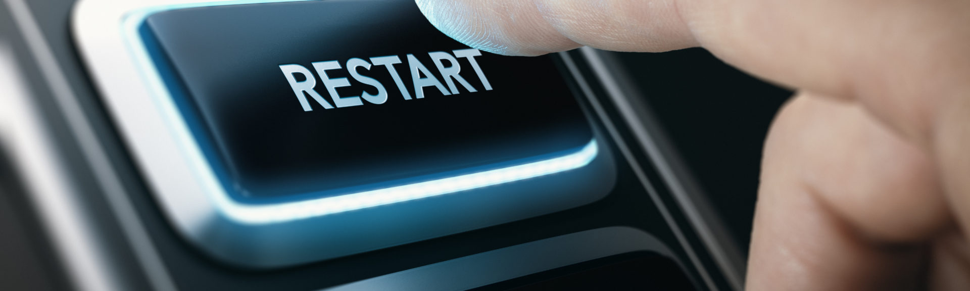 Man pressing a button to restart national economy after crisis. Composite image between a hand photography and a 3D background.
