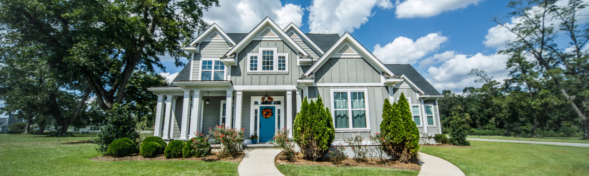 Gray New Construction Modern Cottage Home with Hardy Board Siding and Teal Door with Curb Appeal