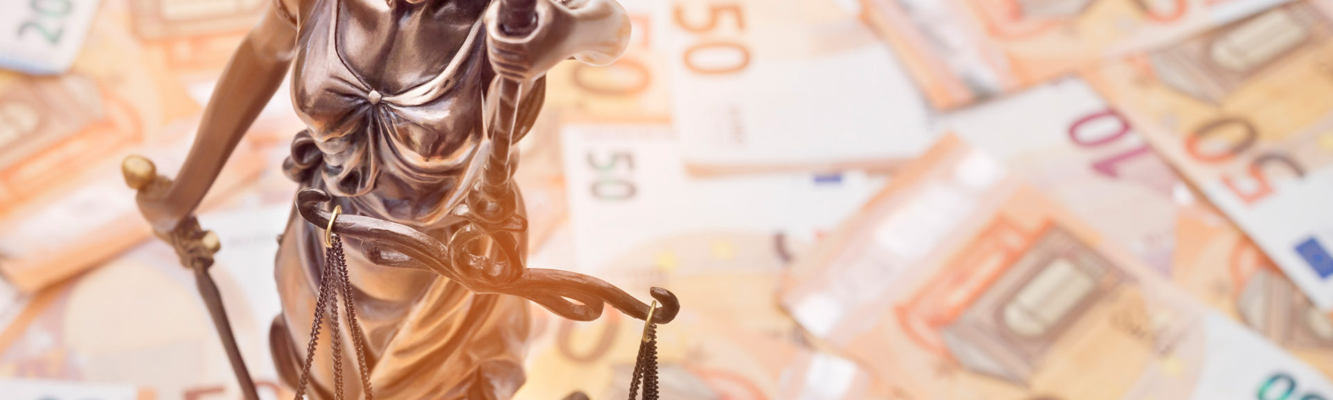 Lady Justice is on several 50 and 20 Euro bills. Concept photo for a lawsuit where a lot of money is at stake.