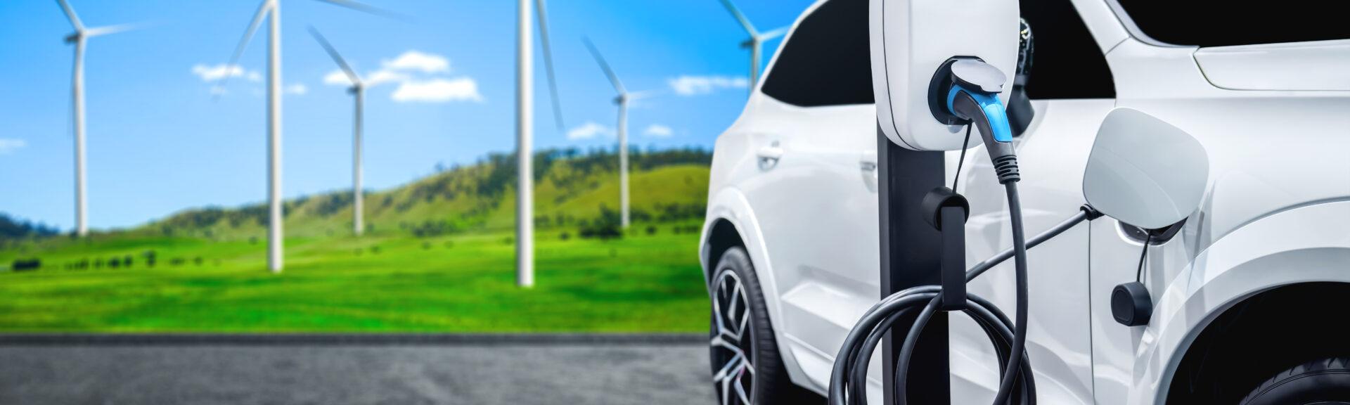EV charging station for electric car in concept of green sustainable energy produced from renewable resources to supply to charger station in order to reduce CO2 emission .