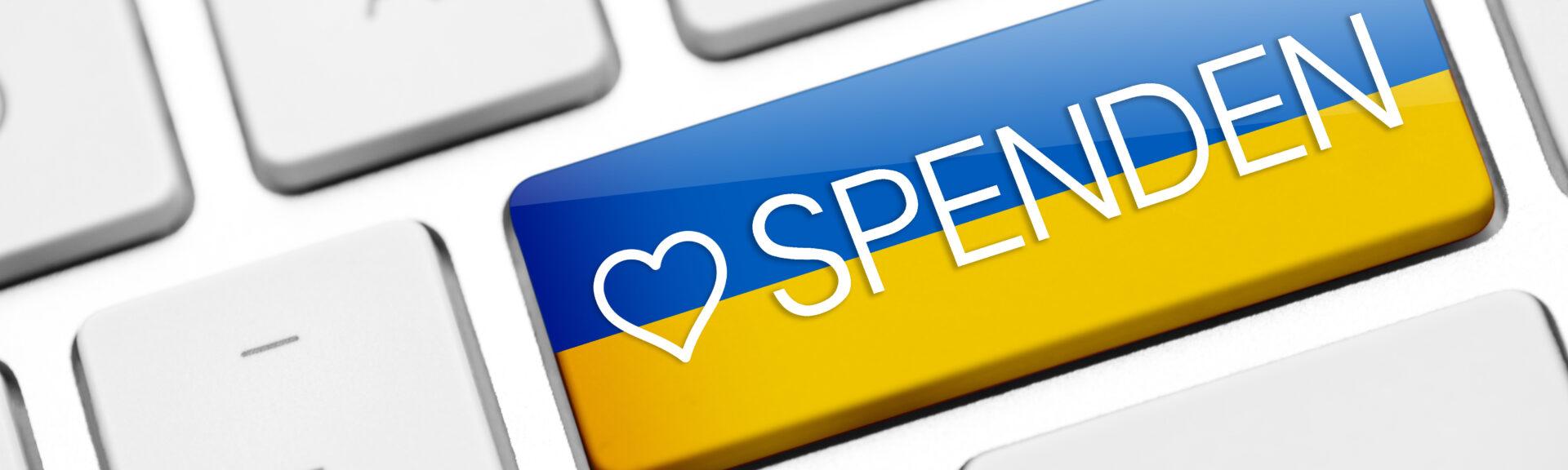 Keyboard key with Ukraine flag and donate text. Donation for Ukraine
