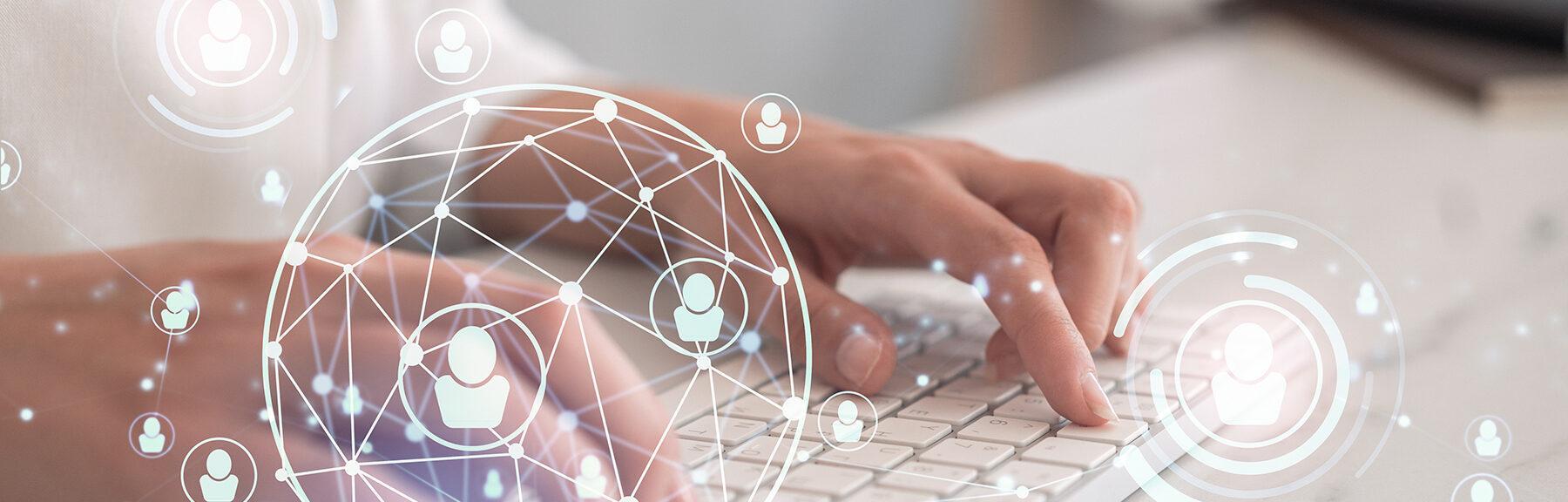 HR woman specialist is typing the keyboard in the internet to find the best candidates to create international network in recruitment process. Formal wear. Social media hologram icons.