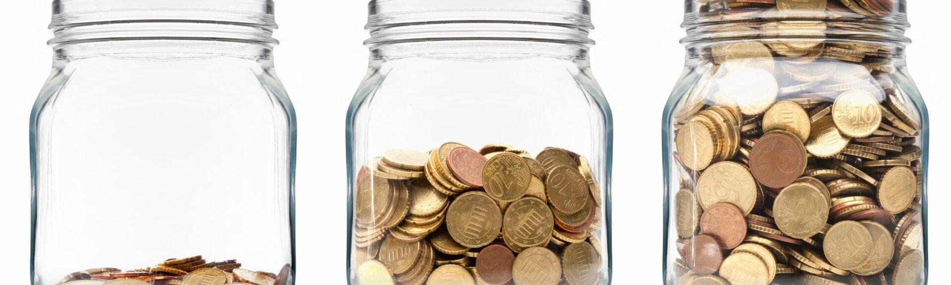 Three glasses filled with coins, getting fuller from left to right. Asset growth