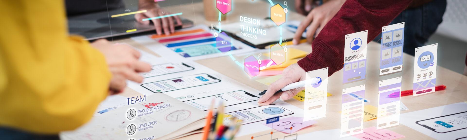 Close up ux developer and ui designer use augmented reality brainstorming about mobile app interface wireframe design on desk at modern office.Creative digital development agency