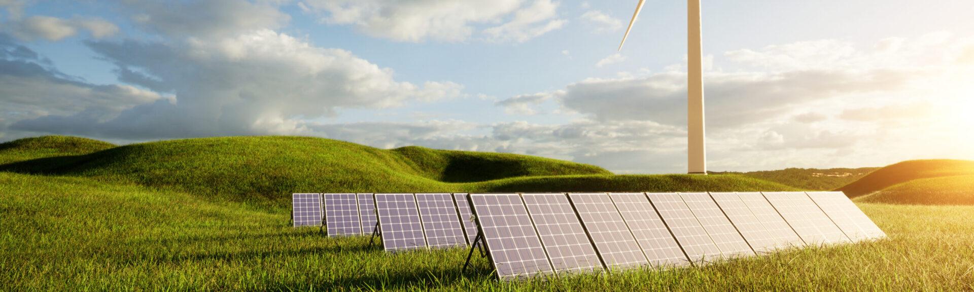 Photovoltaikanlage auf grüner Wiese mit Windrad im Hintergrund
