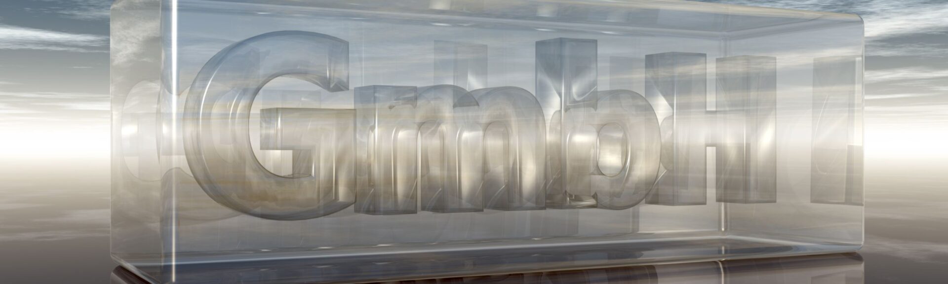 GmbH Schriftzug in einem Glasgehäuse