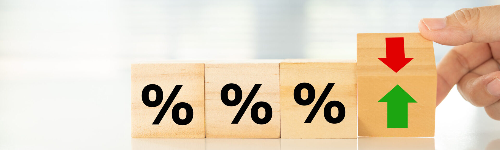 Interest rate hike and Finance banking economic policy concept. Wooden blocks with Icon percentage and arrow.
